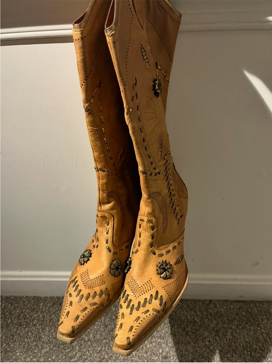 BCBG Shoes - BCBG boots size 9.5 in like new condition with a little wear at the bottom.